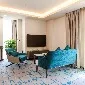 Sofa and TV at Two Bedroom Duplex at Dao by Dorsett West London.